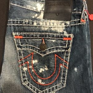 Men’s splattered paint/ripped True Religions